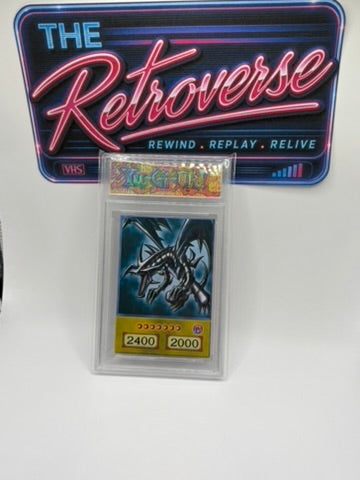 A graded Yu-Gi-Oh! trading card in a clear plastic slab, displayed in front of a branded 'The Retroverse' sign. The card features the Red-Eyes Black Dragon illustration.