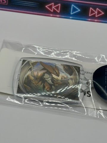 A Pokémon keyring of Kabutops, sealed in a clear plastic bag with a white backing card, shown on a light gray surface.