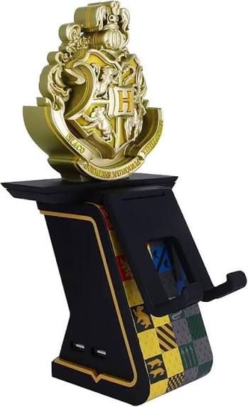 A gold and black Harry Potter Hogwarts crest phone stand on a white background. Harry Potter-themed gaming controller stand shown without a controller.
