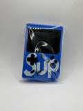 A blue handheld gaming console style accessory with a black screen area and large white 'Sup' lettering, sealed in clear plastic packaging against a light gray background.