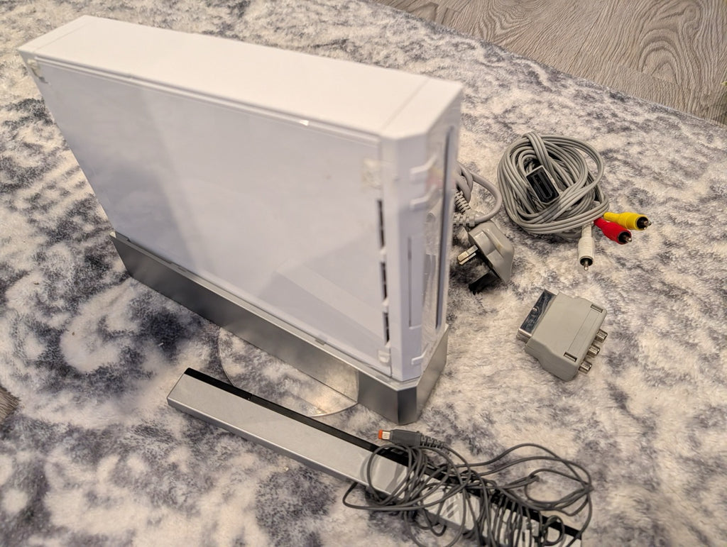 Old computer monitor with cables on a marble surface