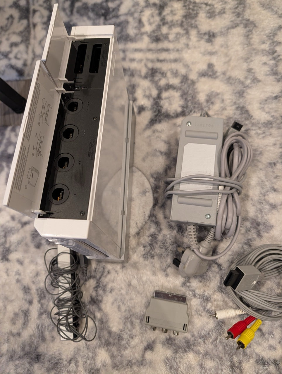 Electrical outlet with multiple cables and connectors on a textured surface