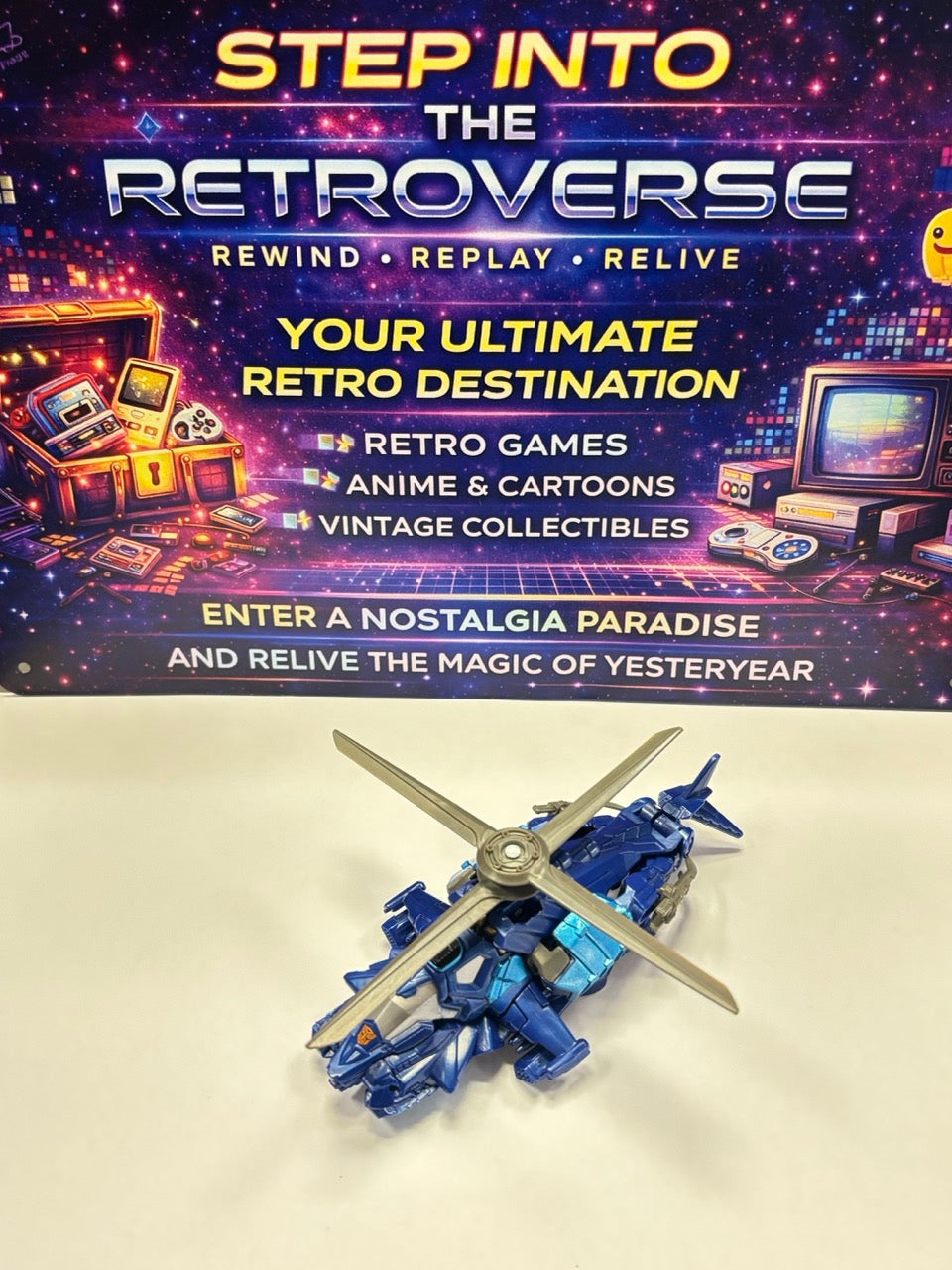 Toy robot with 'Step into the Retroverse' box in the background