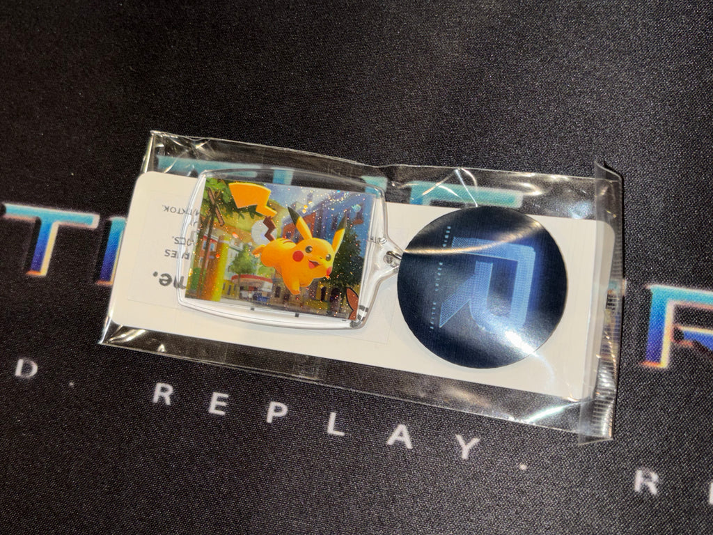 Pokémon trading card with a blue circular item on a black background