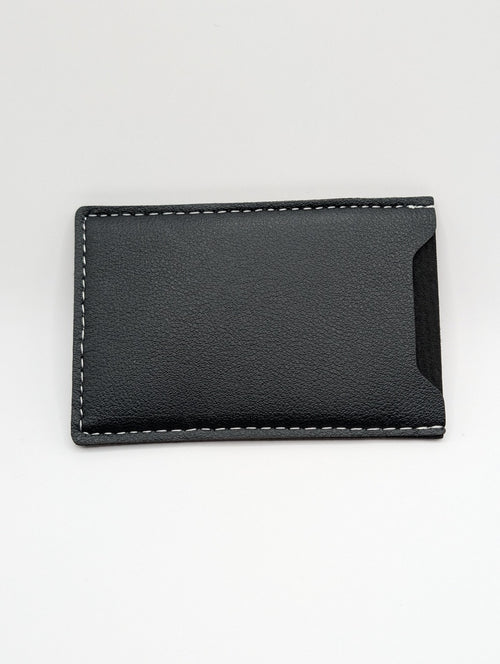 Black leather wallet on a light gray background