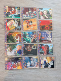 Collection of colorful trading cards featuring various characters on a wooden surface.