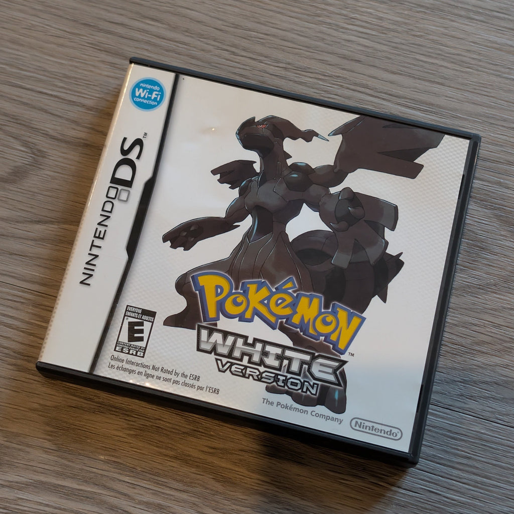 Pokémon White Version game case for Nintendo DS on a wooden surface