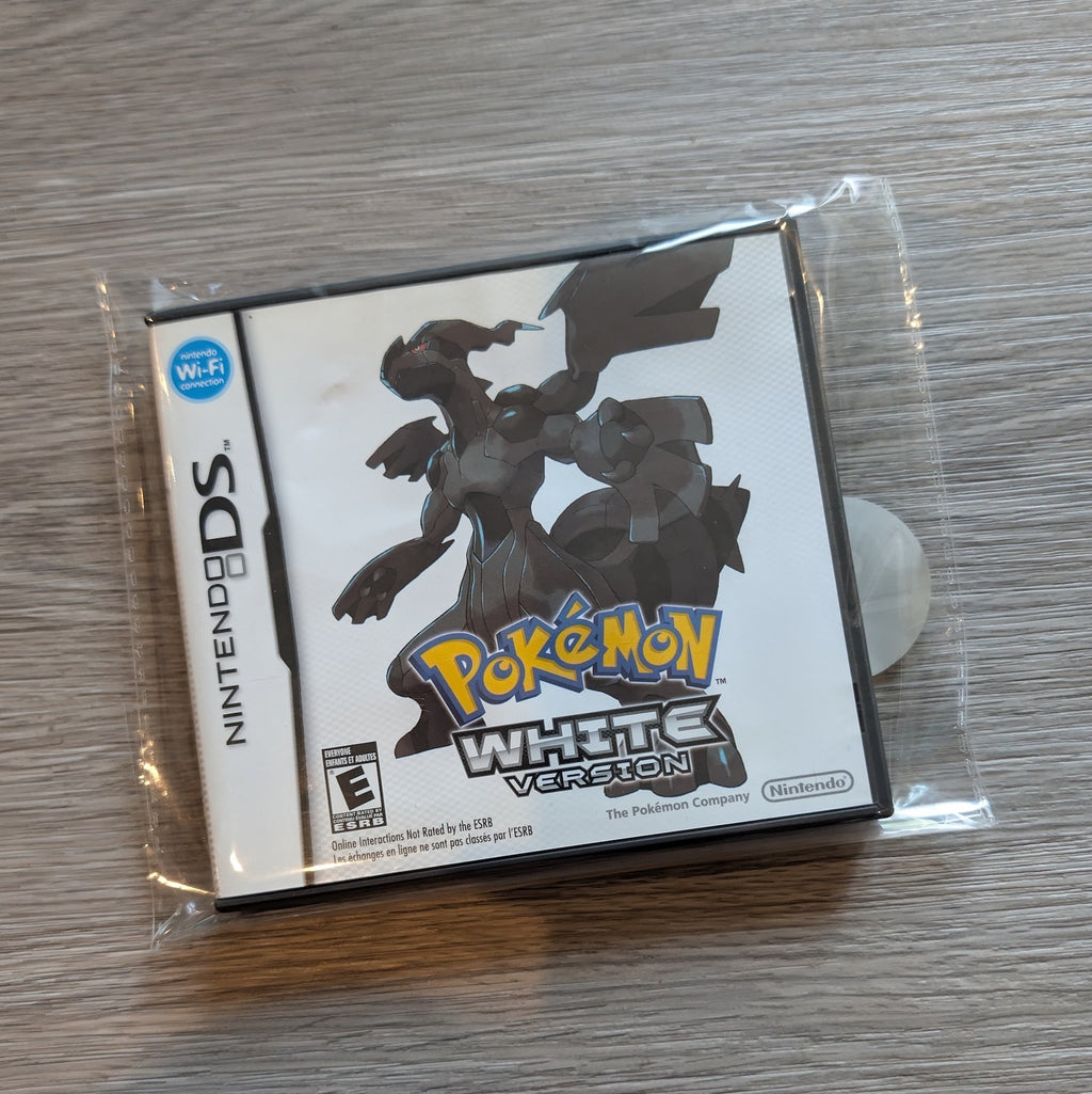 Pokémon White Version game case for Nintendo DS on a wooden surface